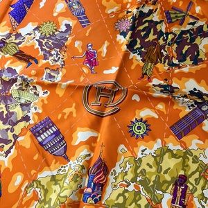 Hermes silk scarf. Stunning Hermes orange with blues, greens, and purple.